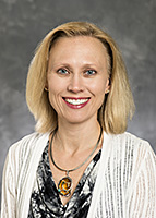 Headshot of Angela Hatfield, MD, a board-certified plastic surgeon