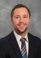 Headshot of Kevin McGuire, a provider who specializes in internal medicine