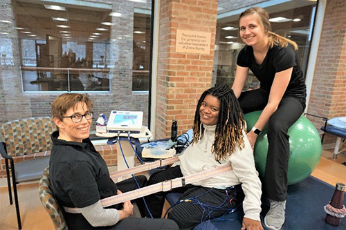 Transitional Rehabilitation Program care team members with patient
