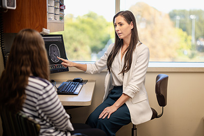 Doctor reviewing brain scans with a patient