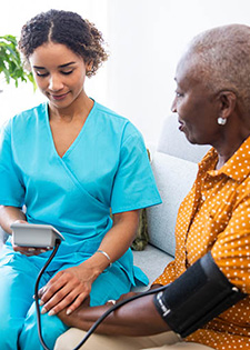 A patient talks to a hospice caregiver