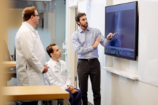 AHBSI specialists discussing the scan of a spine