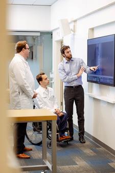 AHBSI specialists discussing the scan of a spine